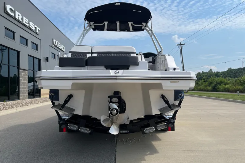 Slide: The Image of 2025 Monterey M6 boat rear view at dealership, showcasing sleek design and powerful engine. - 8