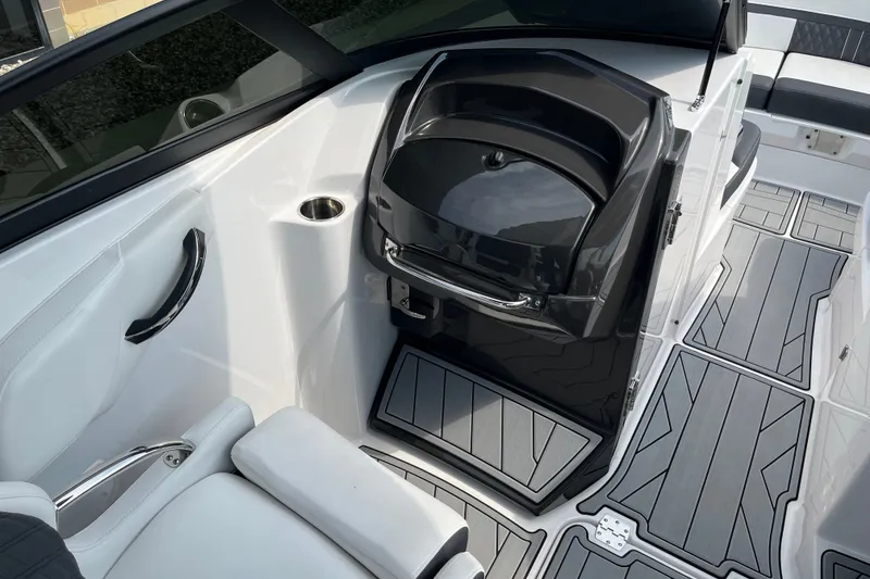 Slide: The Image of 2025 Monterey M6 boat interior with sleek seating and modern flooring design. - 13