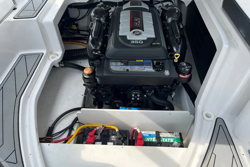 Slide: The Image of Engine compartment of a 2025 Monterey M6 boat featuring a 6.2L 350 horsepower engine. - 21
