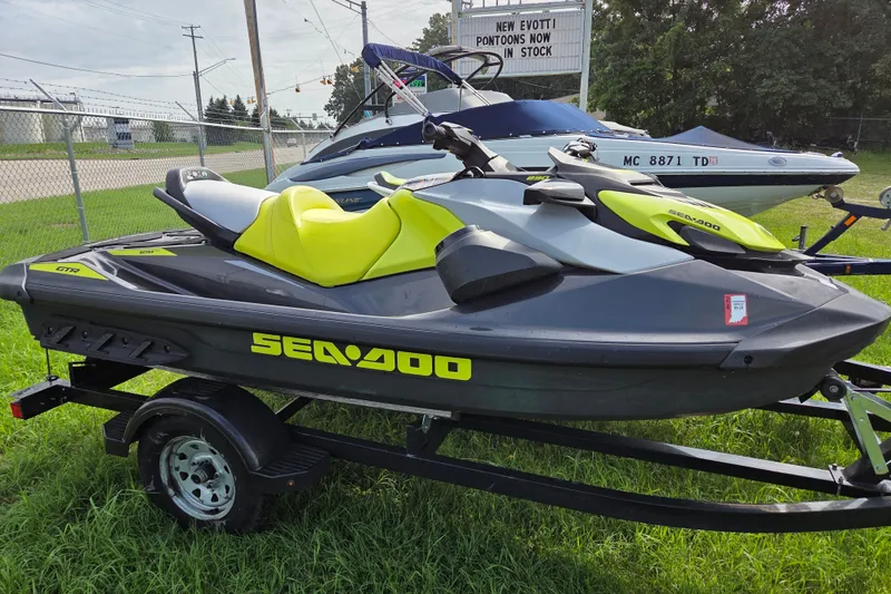 Slide: The Image of 2020 Sea Doo GTR 230 jet ski on trailer, displayed outdoors. - 3