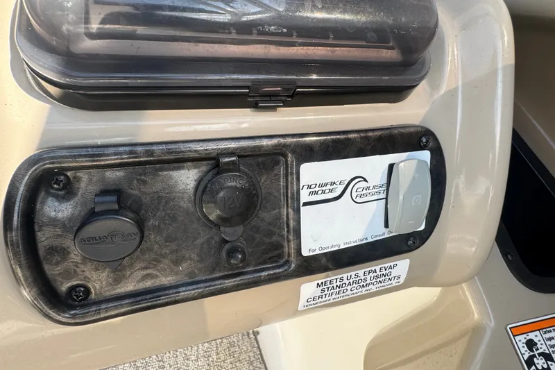 Slide: The Image of Control panel of a 2012 Yamaha Boats 242 Limited S, featuring no wake mode and cruise assist. - 13