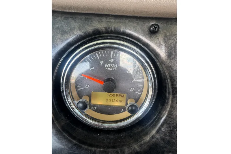 Slide: The Image of Close-up of a 2012 Yamaha Boats 242 Limited S RPM gauge showing 1250 RPM. - 18