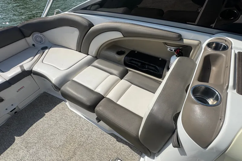 Slide: The Image of 2012 Yamaha Boats 242 Limited S interior seating with cup holders and storage compartments. - 9