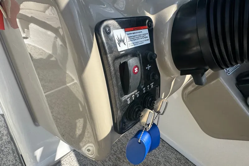 Slide: The Image of Control panel of a 2012 Yamaha Boats 242 Limited S with ignition keys. - 14