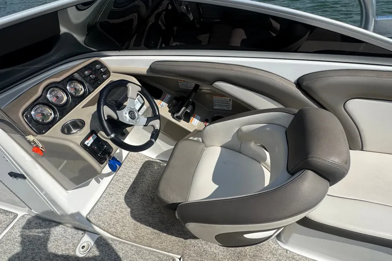 Slide: The Image of Interior cockpit of 2012 Yamaha Boats 242 Limited S with steering wheel and gauges. - 10