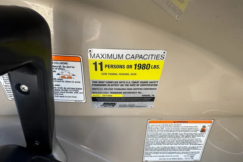 Slide: The Image of Capacity label on 2012 Yamaha Boats 242 Limited S, max 11 people or 1980 lbs. - 12