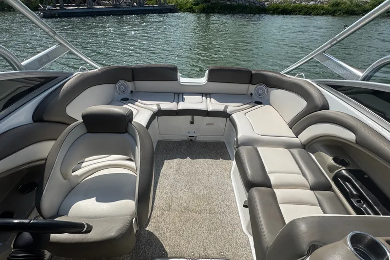 Slide: The Image of Interior of a 2012 Yamaha Boats 242 Limited S, featuring spacious seating and elegant design. - 8
