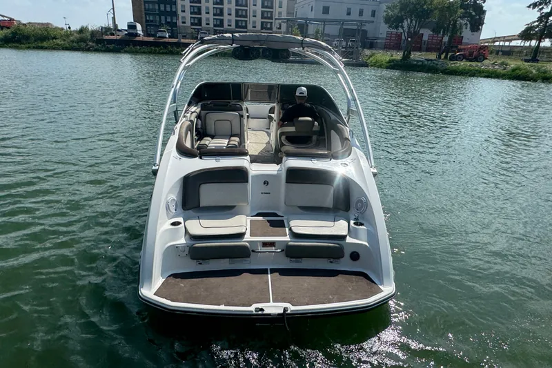 Slide: The Image of 2012 Yamaha Boats 242 Limited S on water, rear view, sunny day. - 3