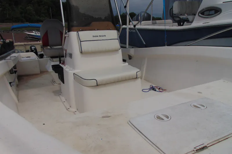 Slide: The Image of 2003 Palm Beach 181 WHITECAP boat interior with seating and storage compartments. - 9