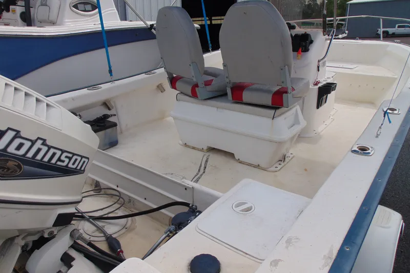 Slide: The Image of 2003 Palm Beach 181 WHITECAP boat interior with Johnson outboard motor and dual seating. - 11