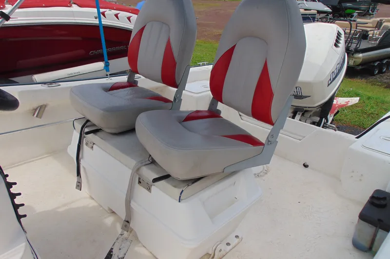 Slide: The Image of Two cushioned boat seats on a 2003 Palm Beach 181 WHITECAP, with red and gray upholstery. - 7