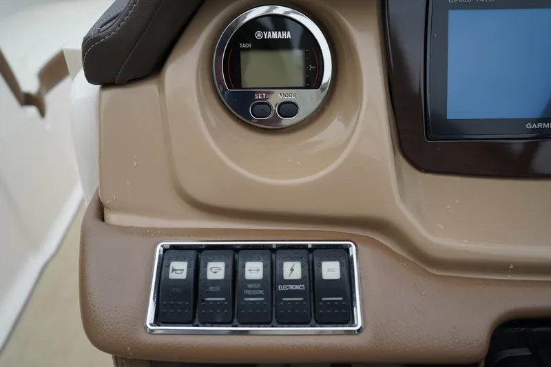 Slide: The Image of Dashboard of 2015 Chaparral 230 Suncoast boat with Yamaha tachometer and control switches. - 10