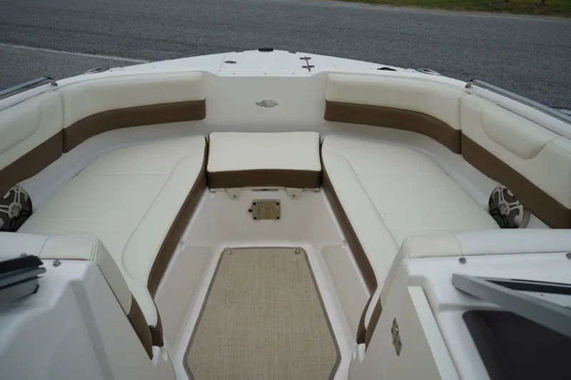 Slide: The Image of Interior view of 2015 Chaparral 230 Suncoast boat with white and brown seating. - 4