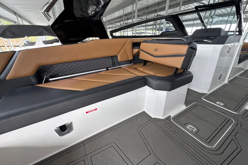 Slide: The Image of 2021 Cobalt R8 Surf boat interior with luxurious tan and black seating. - 27
