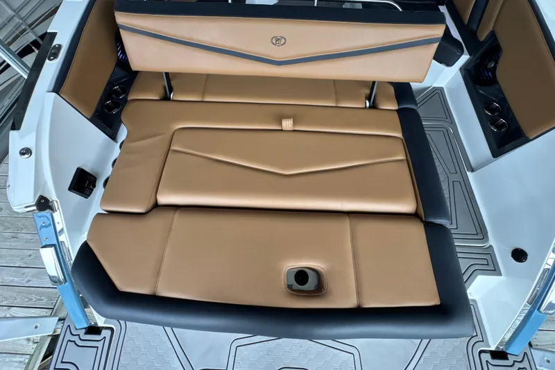 Slide: The Image of 2021 Cobalt R8 Surf boat interior with tan leather seating and modern design. - 10
