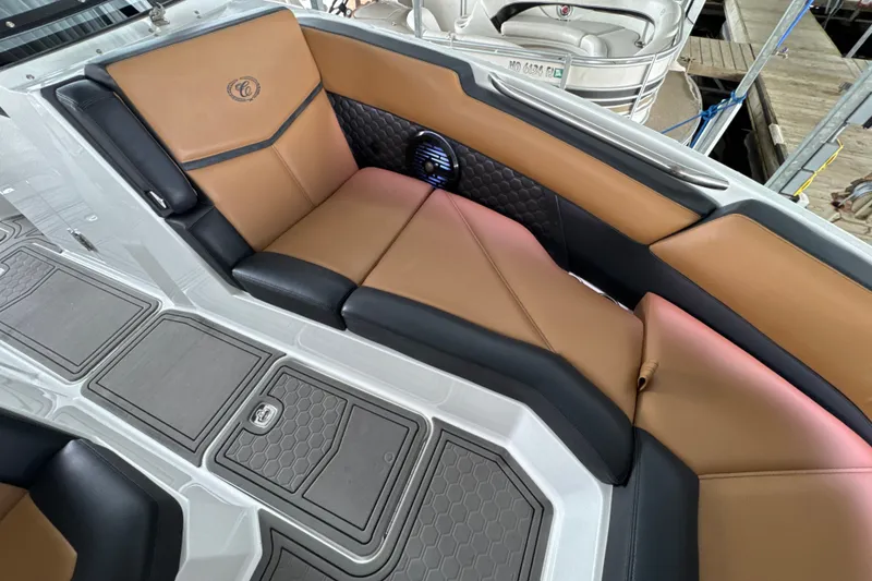 Slide: The Image of Luxurious interior of 2021 Cobalt R8 Surf boat with tan and black seating. - 25