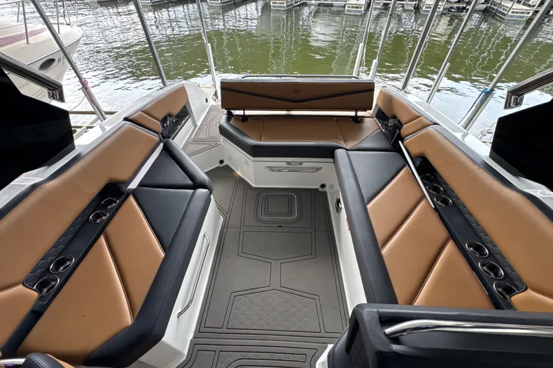 Slide: The Image of Luxurious interior of 2021 Cobalt R8 Surf boat with tan and black seating. - 12