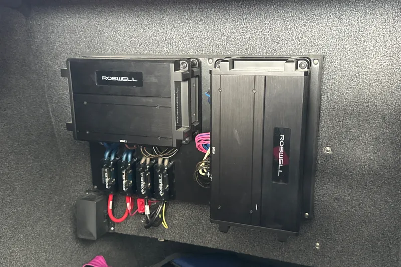 Slide: The Image of Roswell audio system in 2021 Cobalt R8 Surf boat, featuring amplifiers and wiring. - 36