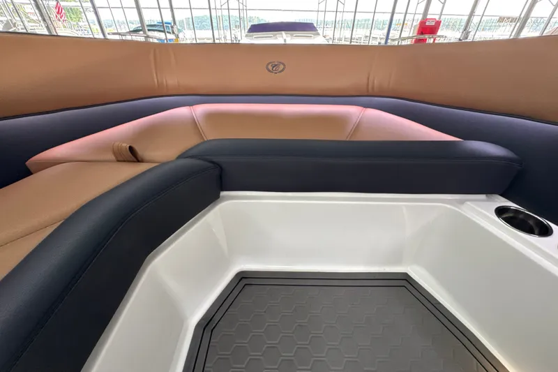 Slide: The Image of Interior of 2021 Cobalt R8 Surf boat with tan and black seating. - 26