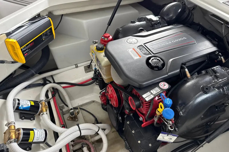 Slide: The Image of Engine compartment of a 2021 Cobalt R8 Surf boat featuring a Volvo Penta engine. - 34