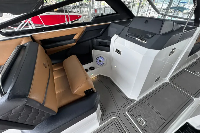 Slide: The Image of Interior of 2021 Cobalt R8 Surf boat with tan and black seating, modern design. - 19
