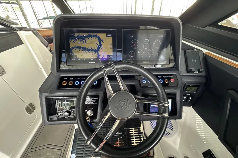 Slide: The Image of Cockpit of 2021 Cobalt R8 Surf boat with Garmin navigation displays and modern controls. - 14