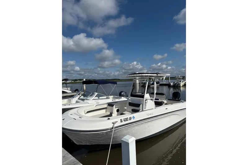 The Image of 2023 Trophy CC24 boat docked under a clear blue sky. - 1