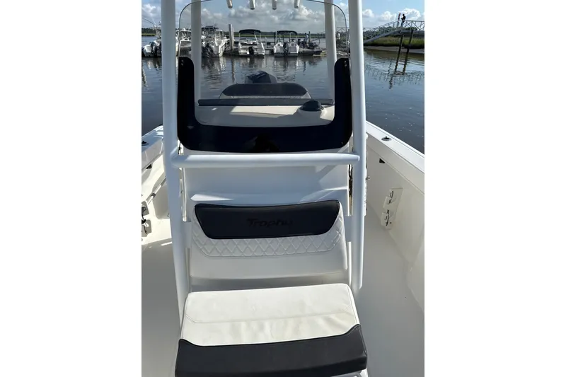 Slide: The Image of 2023 Trophy CC24 boat interior with seating, docked at marina. - 6
