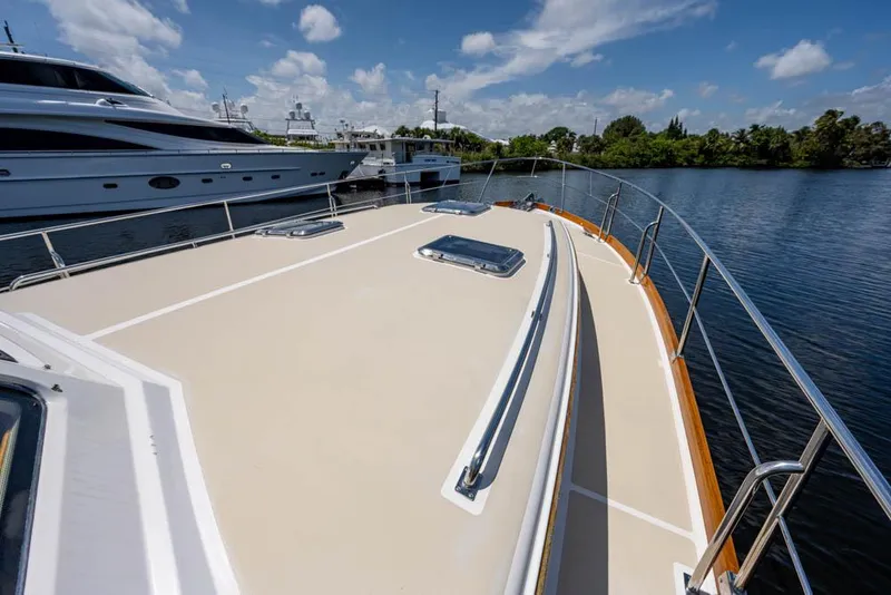 Slide: The Image of The deck of a 2007 Grand Banks 43 Eastbay SX with a clear view of the water. - 13
