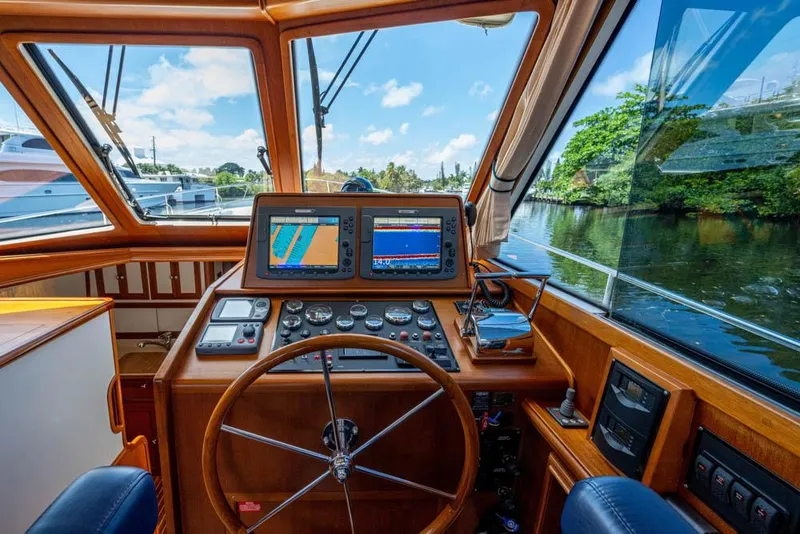 Slide: The Image of Helm of the 2007 Grand Banks 43 Eastbay SX with wood finish and modern navigation systems. - 35