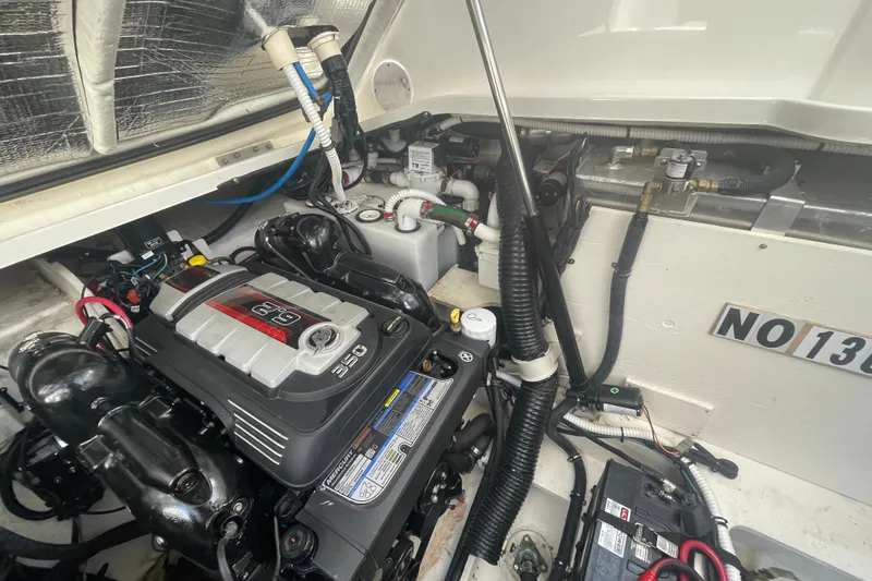 Slide: The Image of Engine compartment of 2018 Sea Ray Sundancer 350 Coupe, featuring a 6.2L engine. - 29
