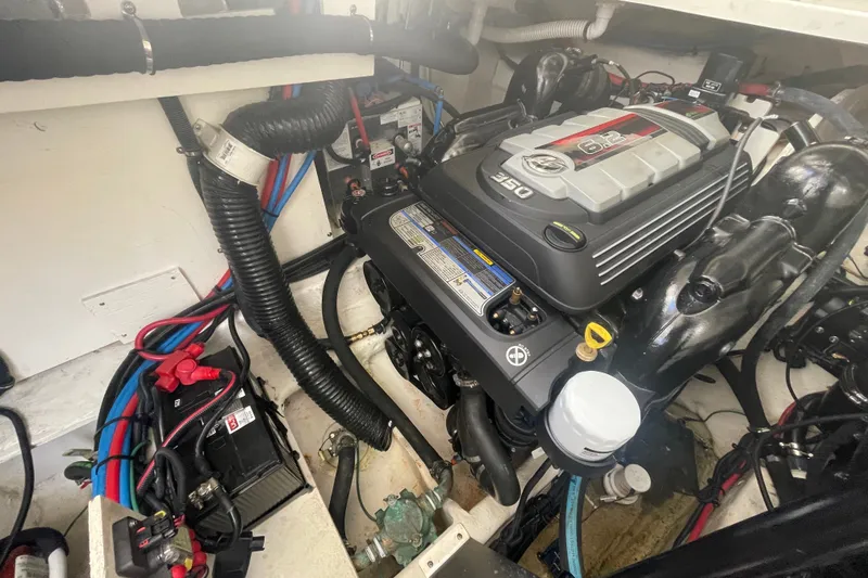 Slide: The Image of Engine compartment of a 2018 Sea Ray Sundancer 350 Coupe, showcasing the powerful engine setup. - 30