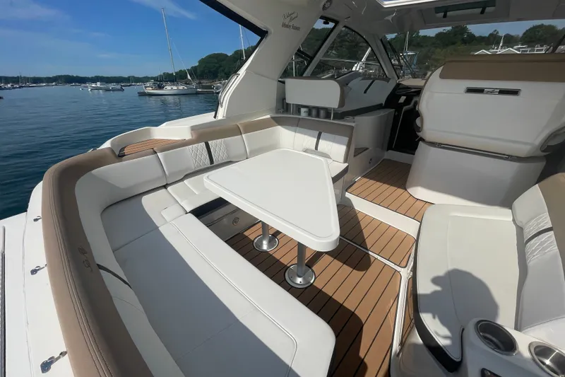 Slide: The Image of Luxurious 2018 Sea Ray Sundancer 350 Coupe interior with elegant seating and table on deck. - 8