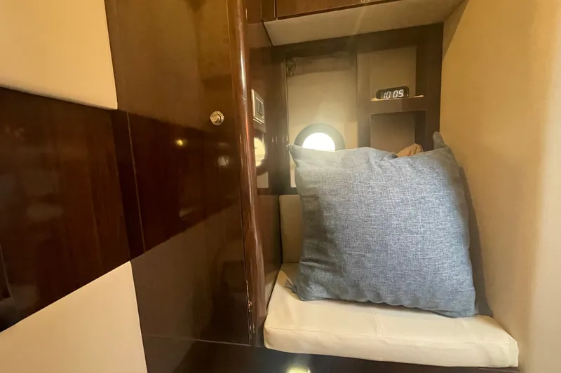 Slide: The Image of Interior cabin of 2018 Sea Ray Sundancer 350 Coupe with cushion and clock. - 20