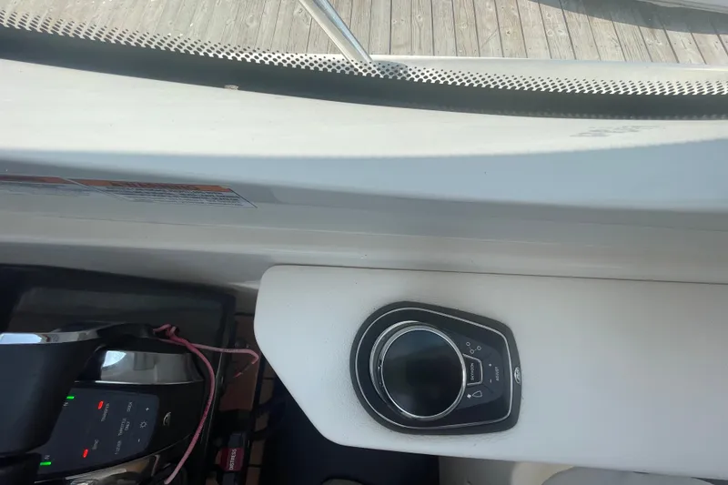 Slide: The Image of 2018 Sea Ray Sundancer 350 Coupe dashboard with control panel and joystick. - 11