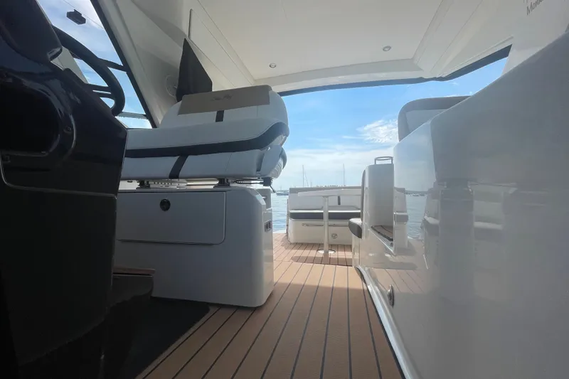 Slide: The Image of Interior view of 2018 Sea Ray Sundancer 350 Coupe, showcasing sleek seating and modern design. - 26