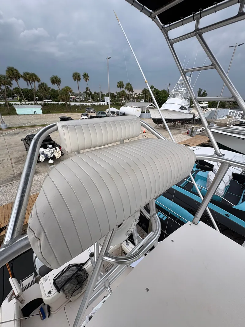 Slide: The Image of A 2005 Grady-White Express 360 with an elevated, cushioned seat on the deck. - 24