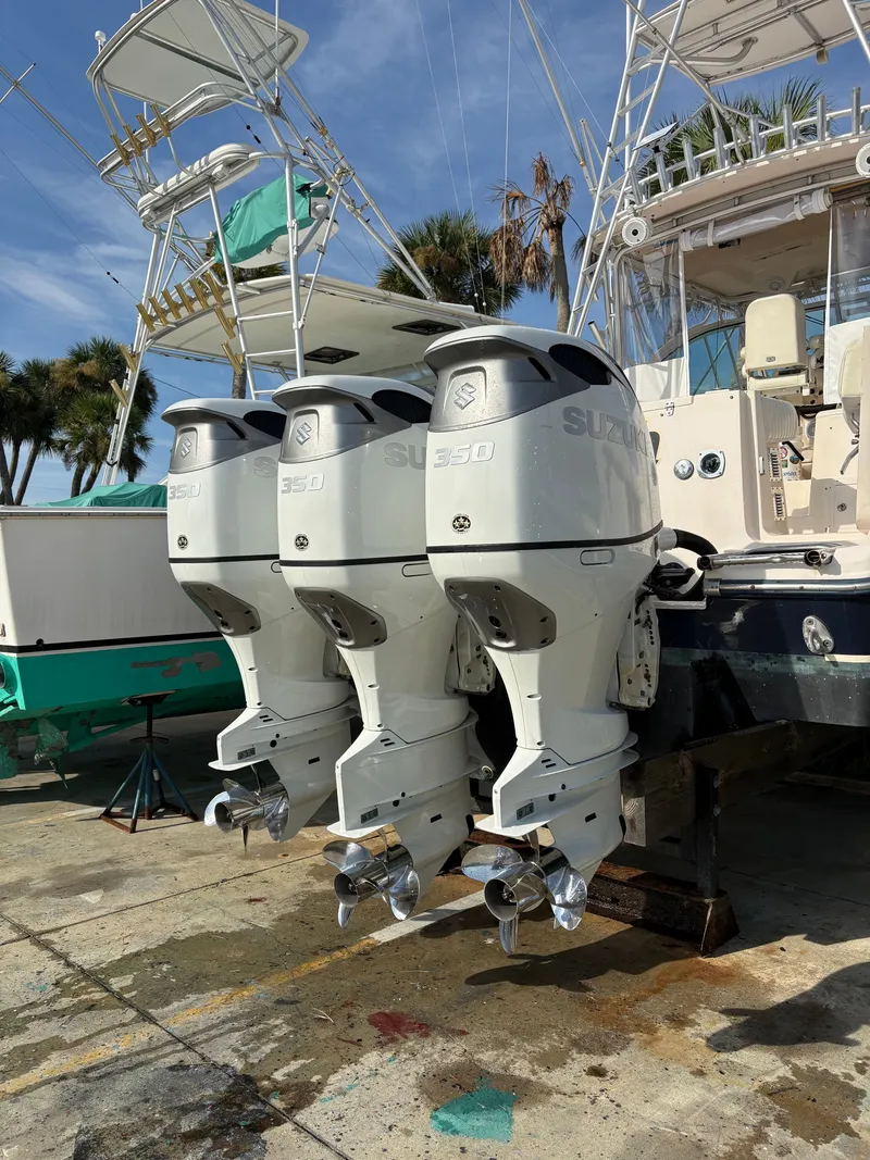 Slide: The Image of A 2005 Grady-White Express 360 boat with three Suzuki outboard engines. - 33