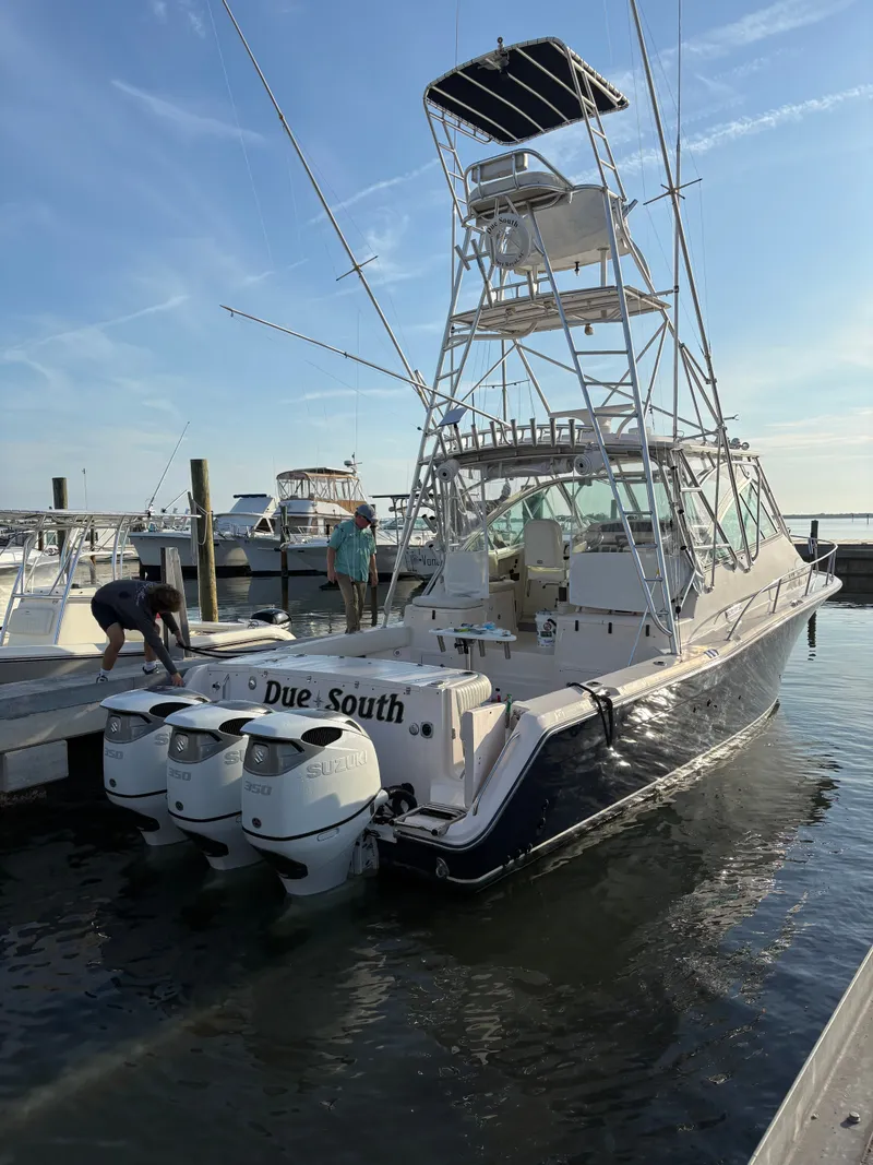 Slide: The Image of 2005 Grady-White Express 360 at dock with three outboard engines. - 25
