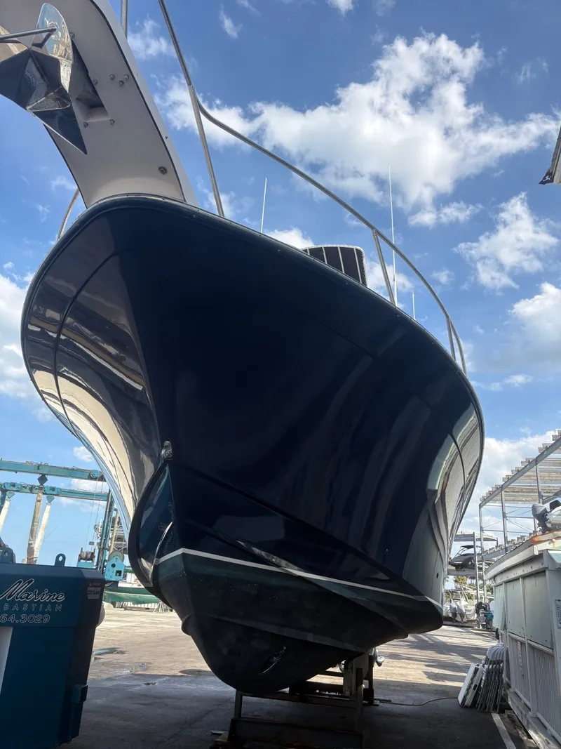 Slide: The Image of The 2005 Grady-White Express 360 is on a dry dock under a blue sky. - 3