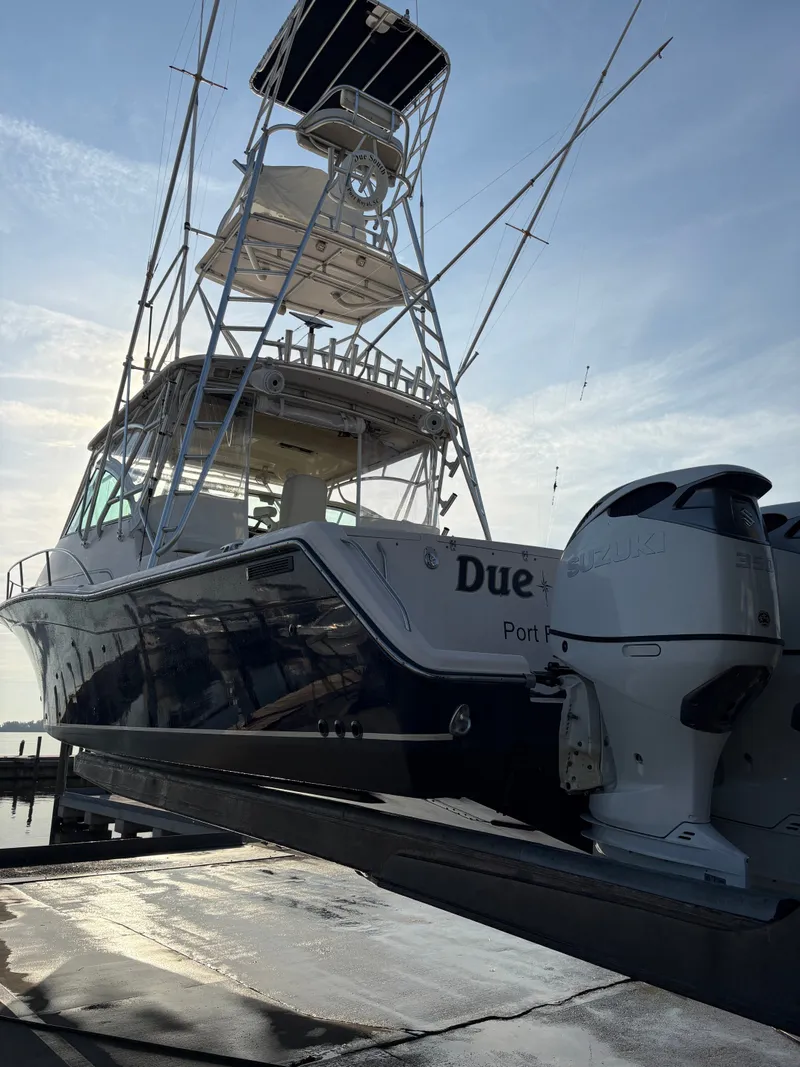 Slide: The Image of A 2005 Grady-White Express 360 boat with dual outboard engines on a trailer. - 31