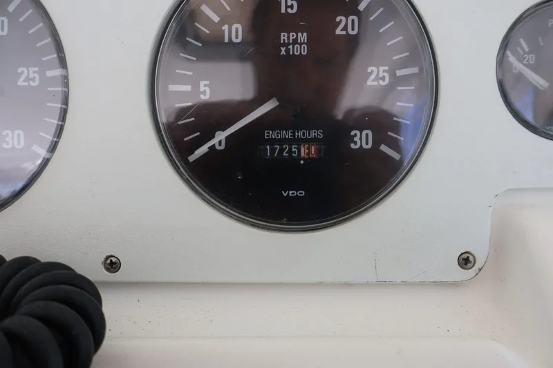 Slide: The Image of Close-up of an engine hour meter showing 1725 hours on a 2001 Cabo 35 Express. - 24