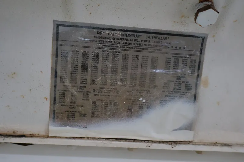 Slide: The Image of A data plate with specifications and information about a Caterpillar engine. - 28