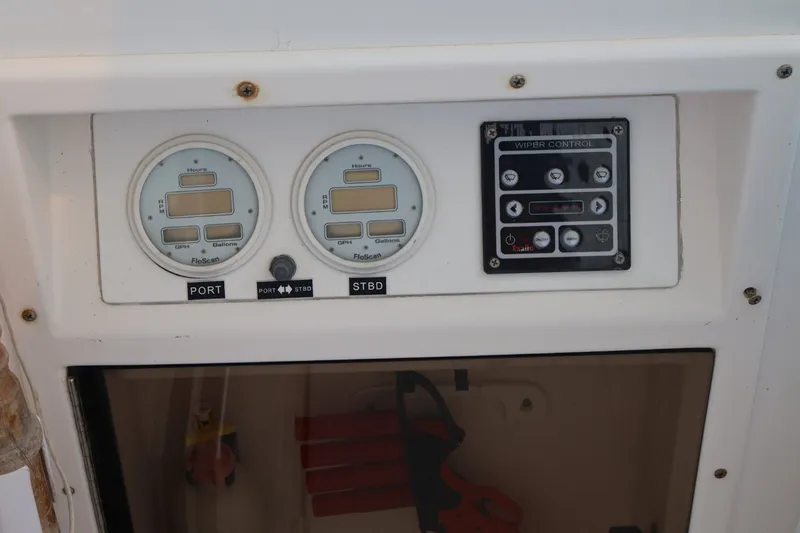 Slide: The Image of Dashboard with two fuel gauges and a wiper control panel. - 11