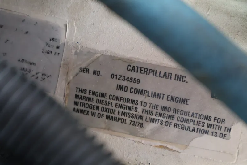 Slide: The Image of Caterpillar engine label with IMO compliance and serial number. - 29