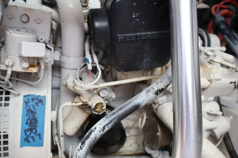 Slide: The Image of Close-up of a boat engine with various pipes and cables. - 32