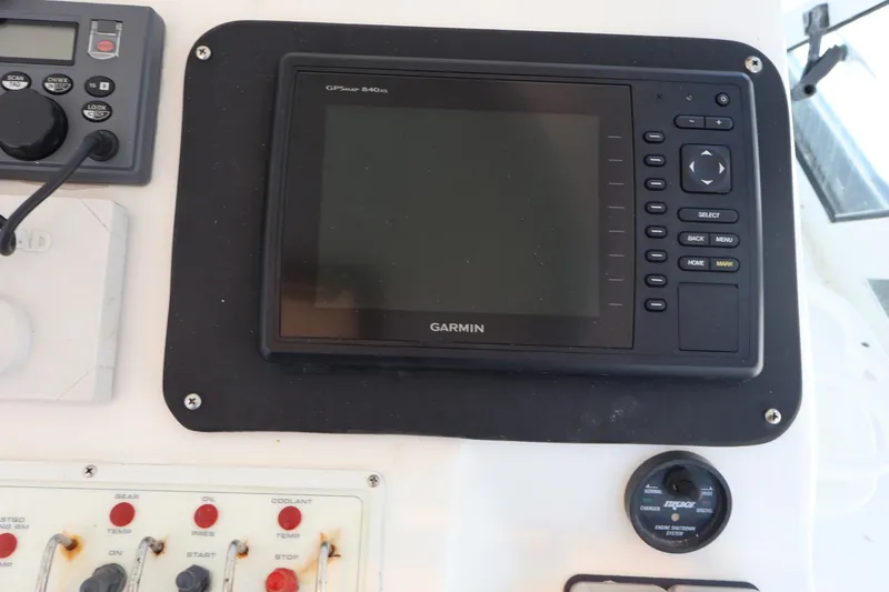 Slide: The Image of A Garmin GPS device is mounted on the dashboard of a 2001 Cabo 35 Express. - 7