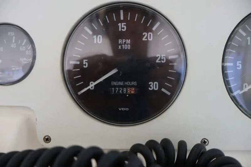 Slide: The Image of Close-up of a tachometer showing 1728 engine hours. - 25