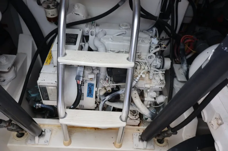 Slide: The Image of Engine room of a 2001 Cabo 35 Express with ladder and engine. - 27