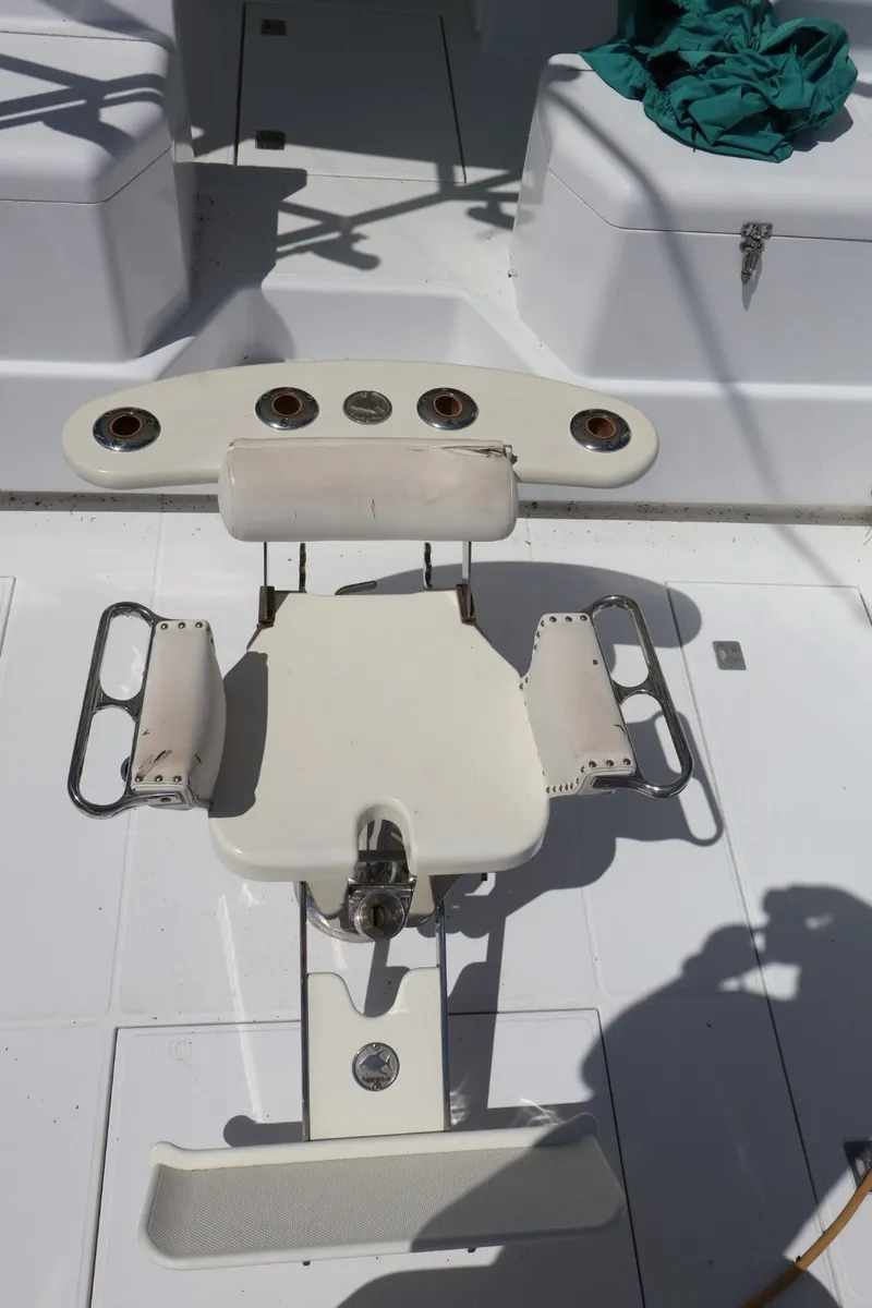 Slide: The Image of Fishing chair on the deck of a 2001 Cabo 35 Express boat. - 6